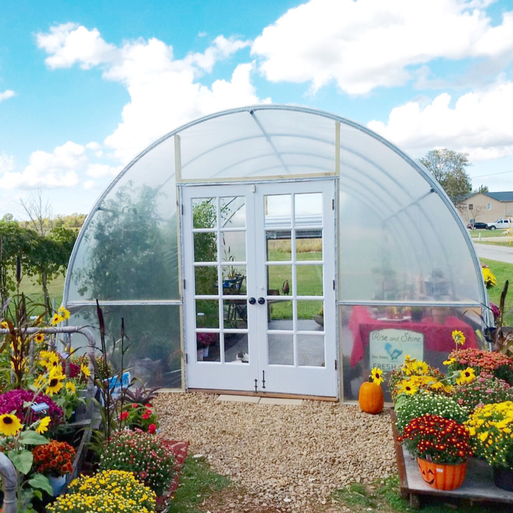 Greenhouse Hoop House In A Decorative Garden
